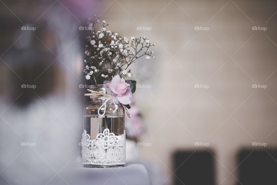 A jar of flowers at a wedding