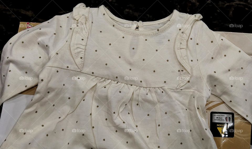 Black polka dot on white dress for baby girls.