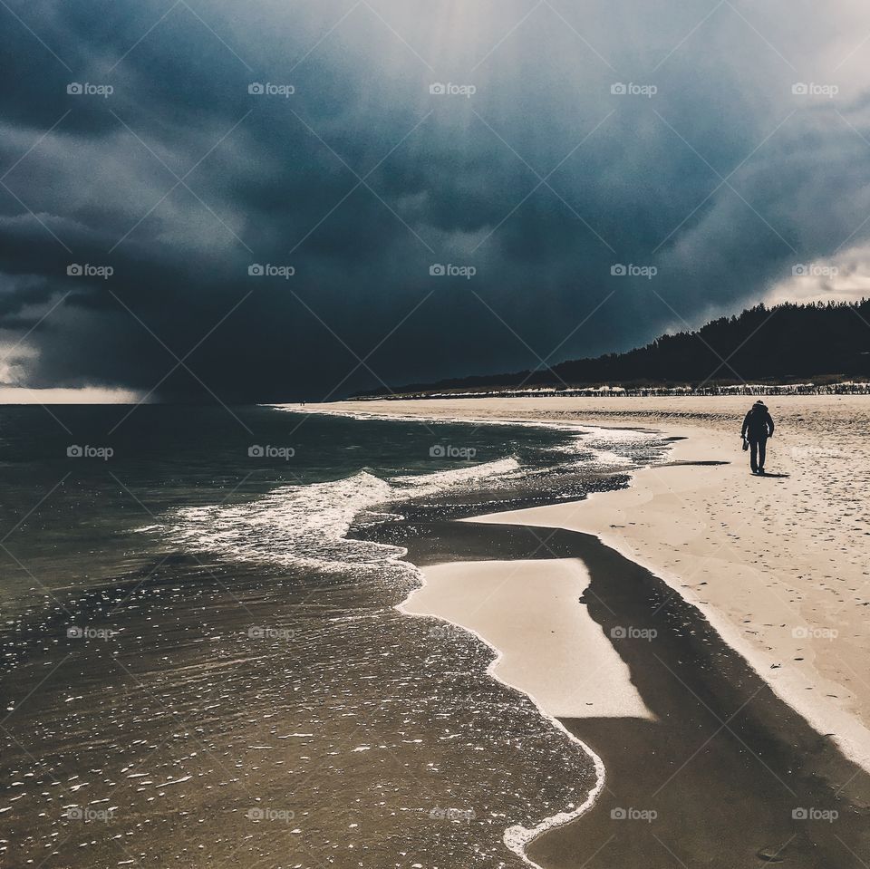 Person walking on coast