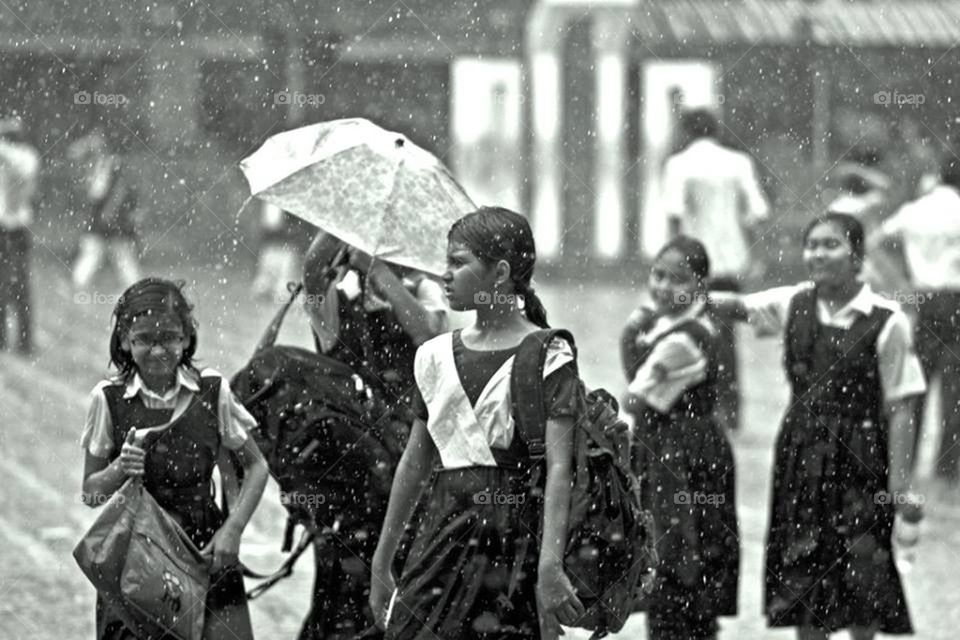 School girls on rain street