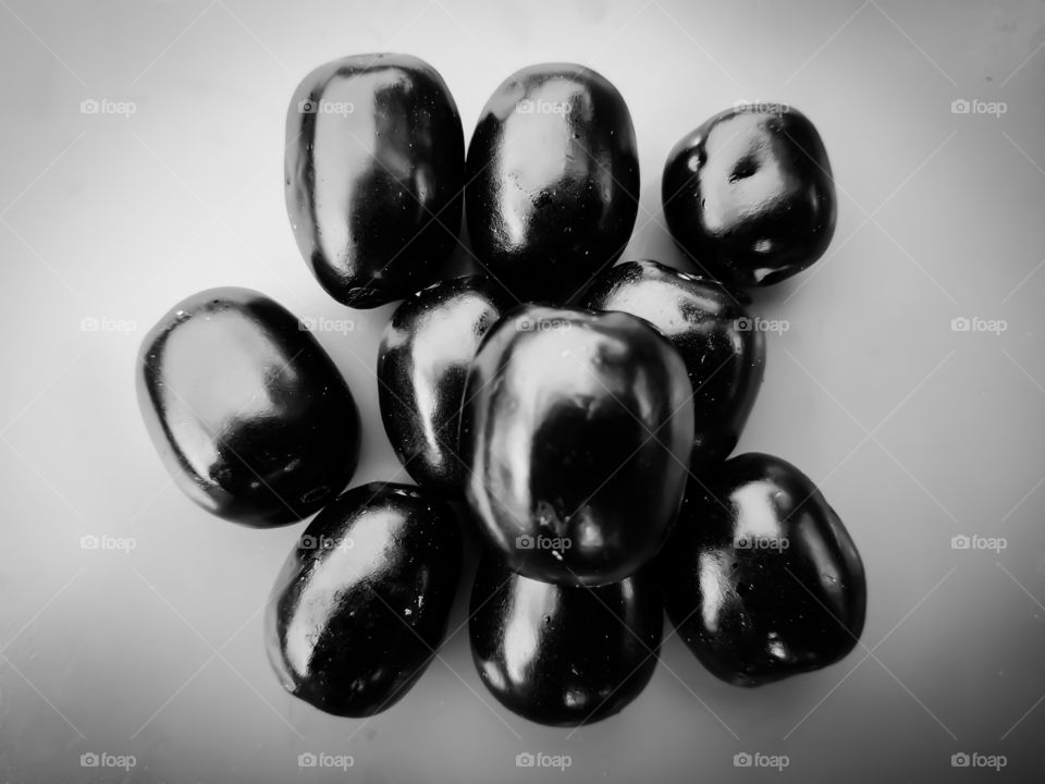 Jambolan plum isolated on black and white background