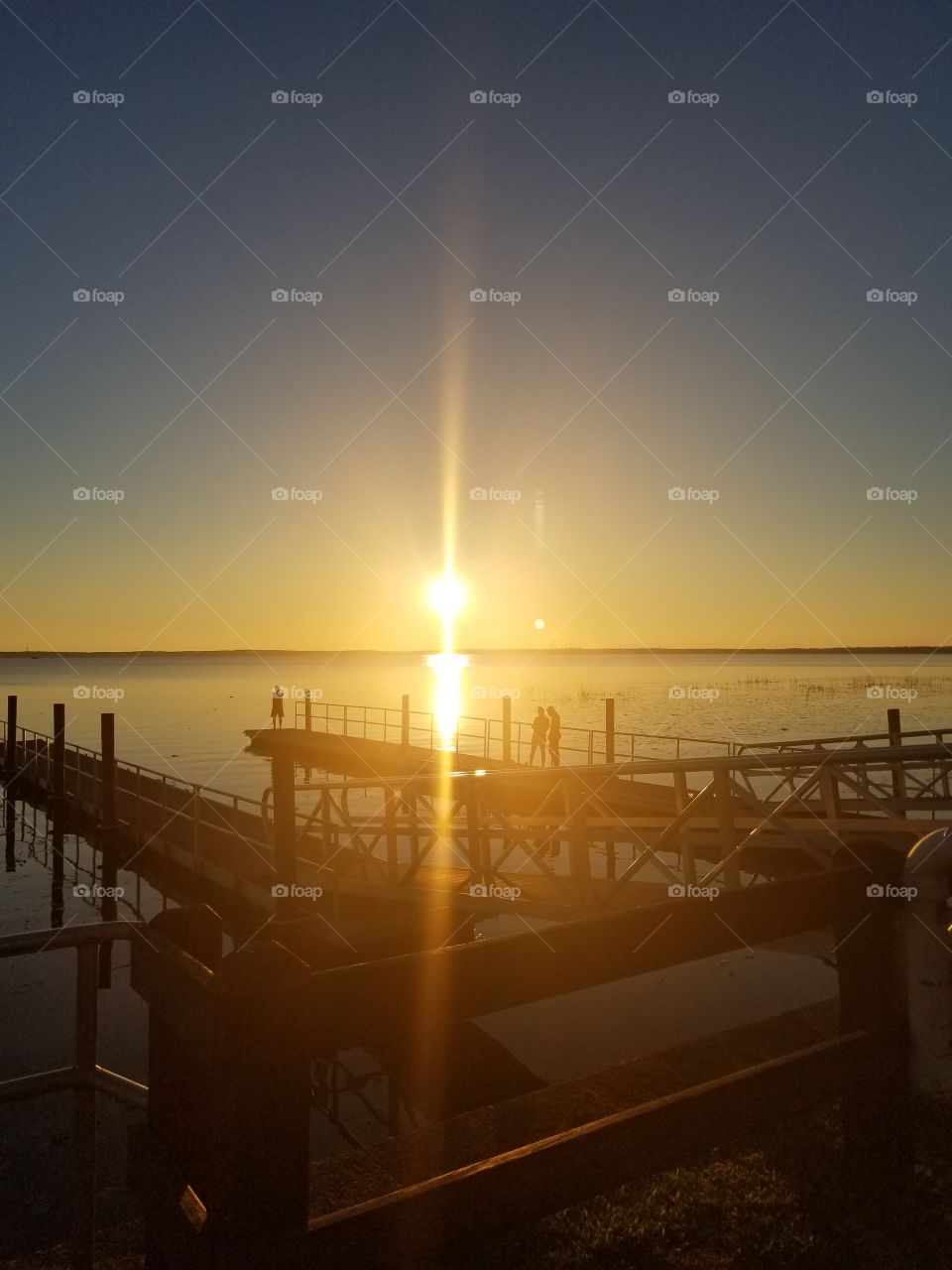 Beautiful Dockside Sunset off the water. Bright And relaxing. Take in all the moments. Take time to stop, get some fresh air and cherish simple little moments like this Sunset at the dock.