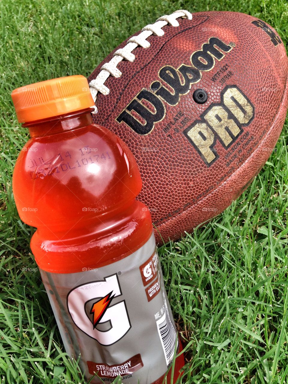 After the game. Wilson football and bottle of Gatorade
