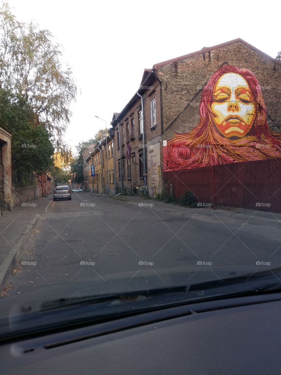 Street view with a painted wall poster