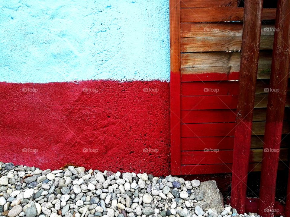 red and blue wall on old hause