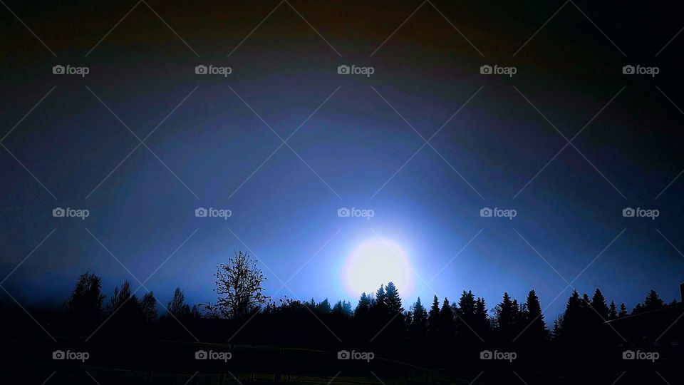 White moon on a blue sky.