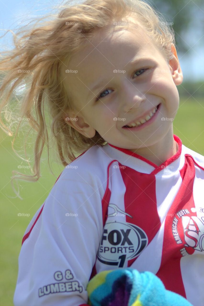 Closeup shot of a beautiful young soccer player in her uniform. 