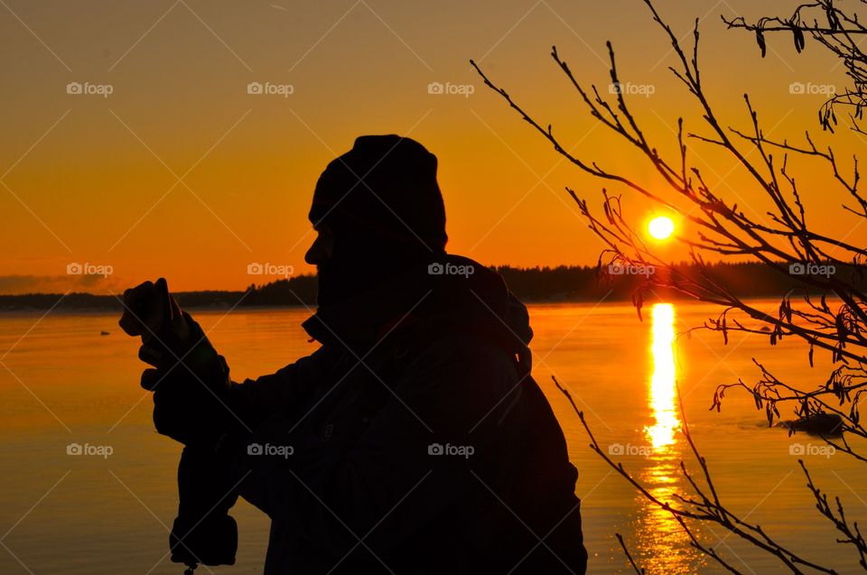 Silhouette of young man during sunset