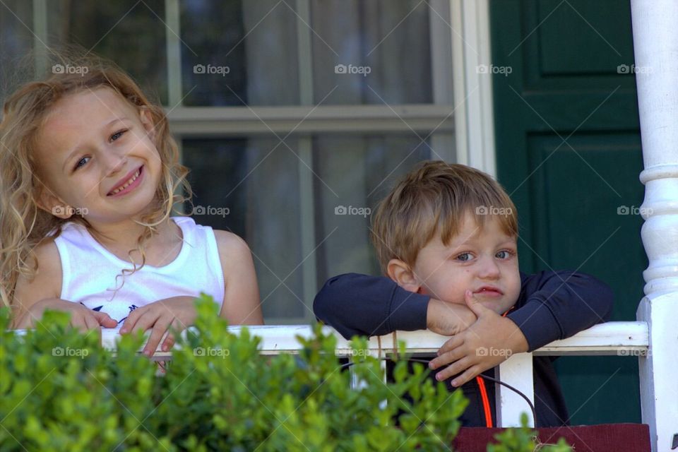 Portrait of smiling sister and brother