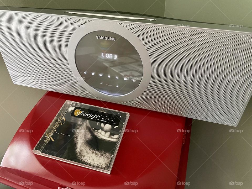Listening to a CD on a Samsung Stereo, Sponge Cd and Samsung stereo, hanging out in the 90’s, relaxing with music, chilling with rock music