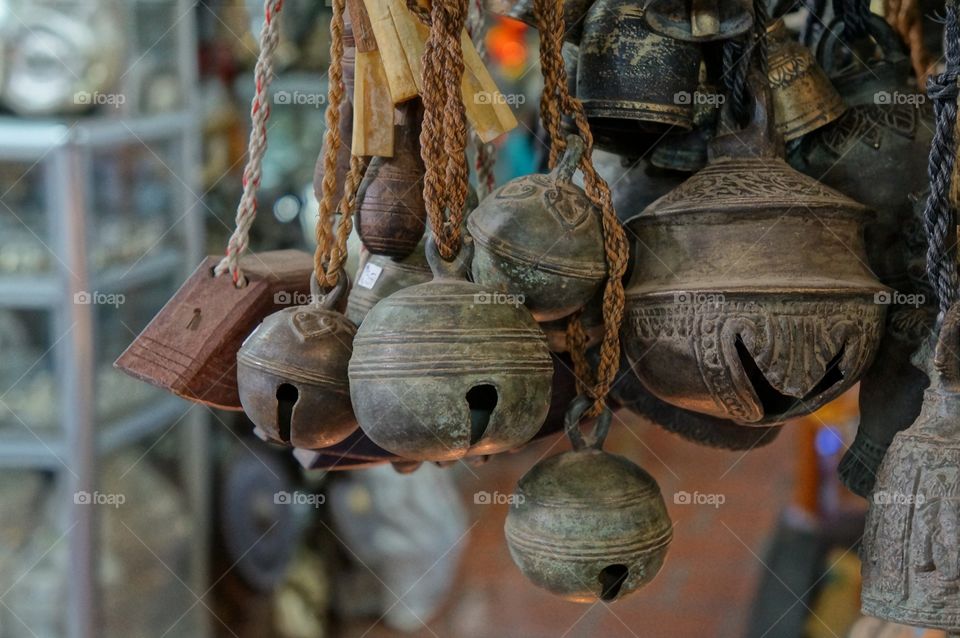 Close-up of bells hanging at market stall