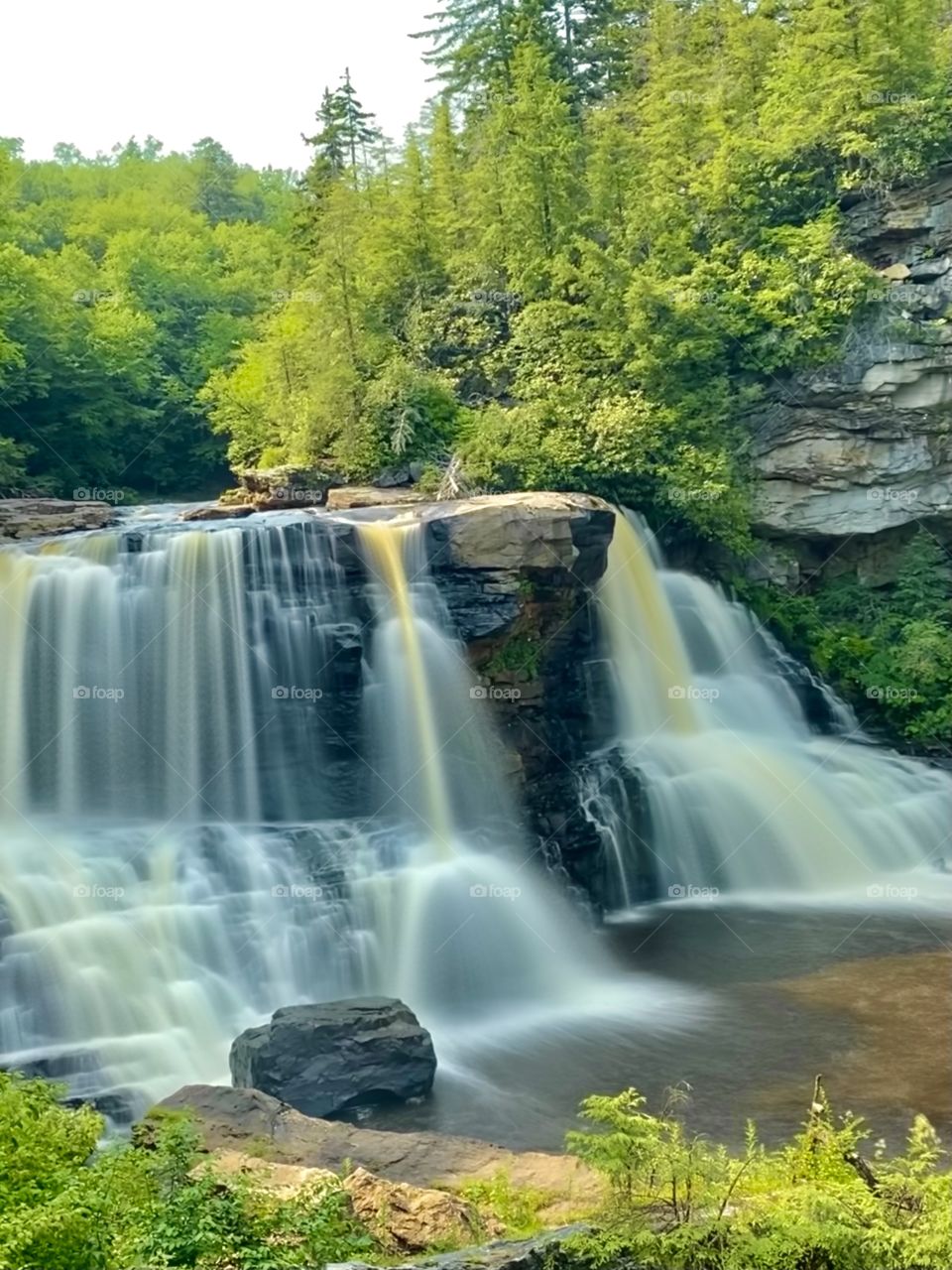 blackwater falls state park in West Virginia, long exposure of the pure, clean water colored naturally by the specific fir trees in the high elevation valley