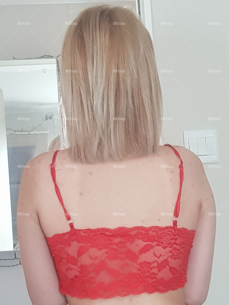 Back view of girl, blonde with straight hair