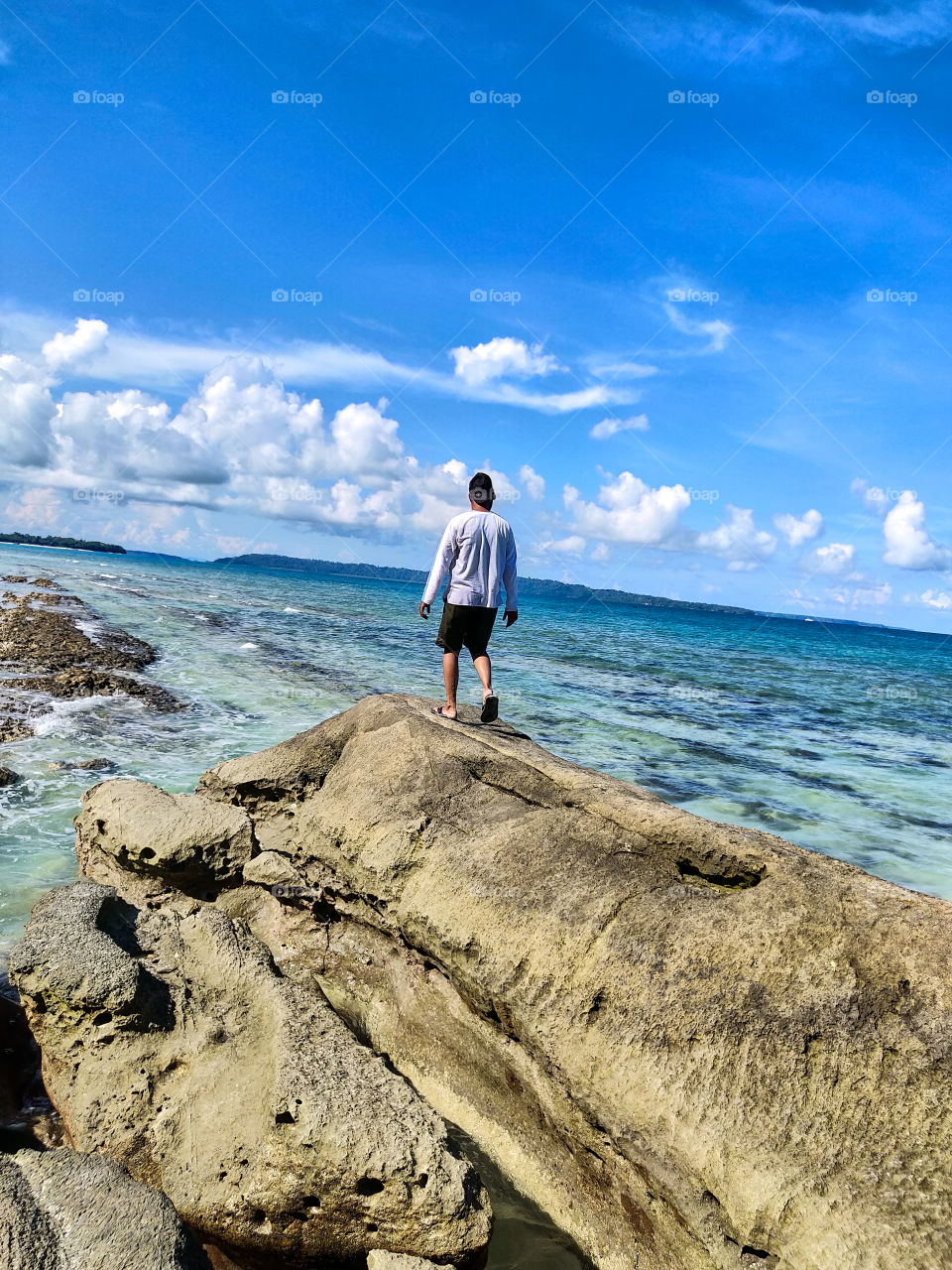 Walking on a beach rock