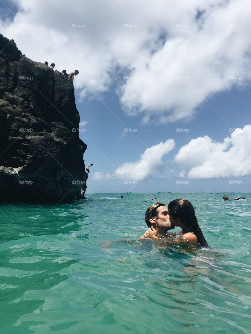Couple kissing in the water