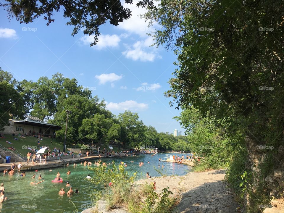 Barton Springs Pool in Austin, Texas. Beat the heat in this oasis nestled in downtown Austin. Pro tip: don’t test the water, just jump in - (it’s freezing!)