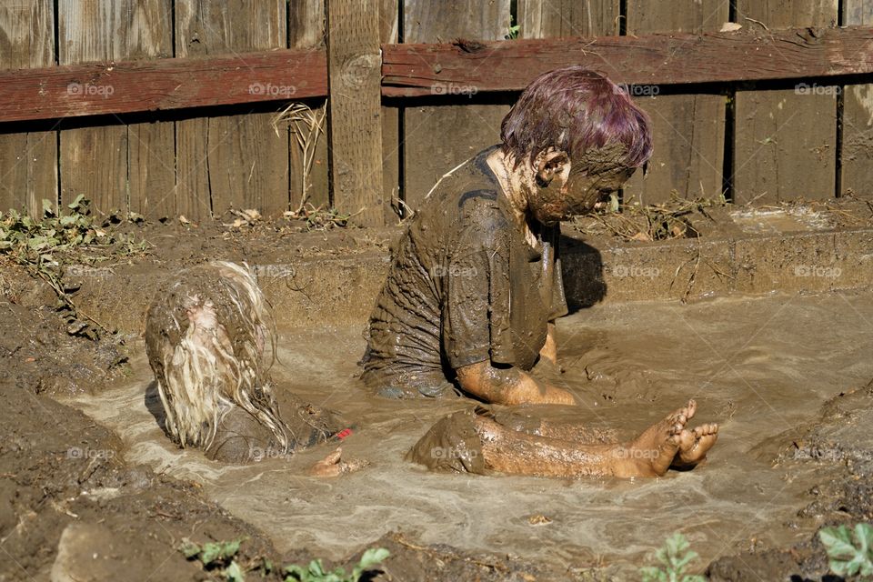 Boys Playing In Mud
