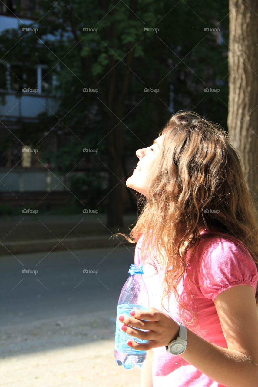 Beautiful girl is enjoying spring. Beautiful girl at the spring sun