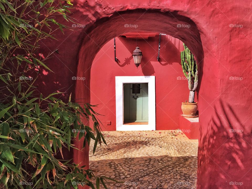 Red house with mexican hacienda vibes.