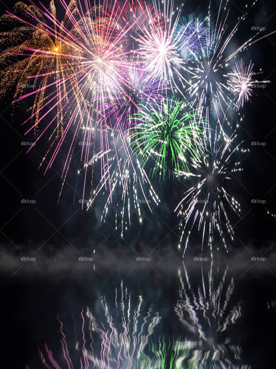 Fireworks reflected on water. Fireworks reflected on water
