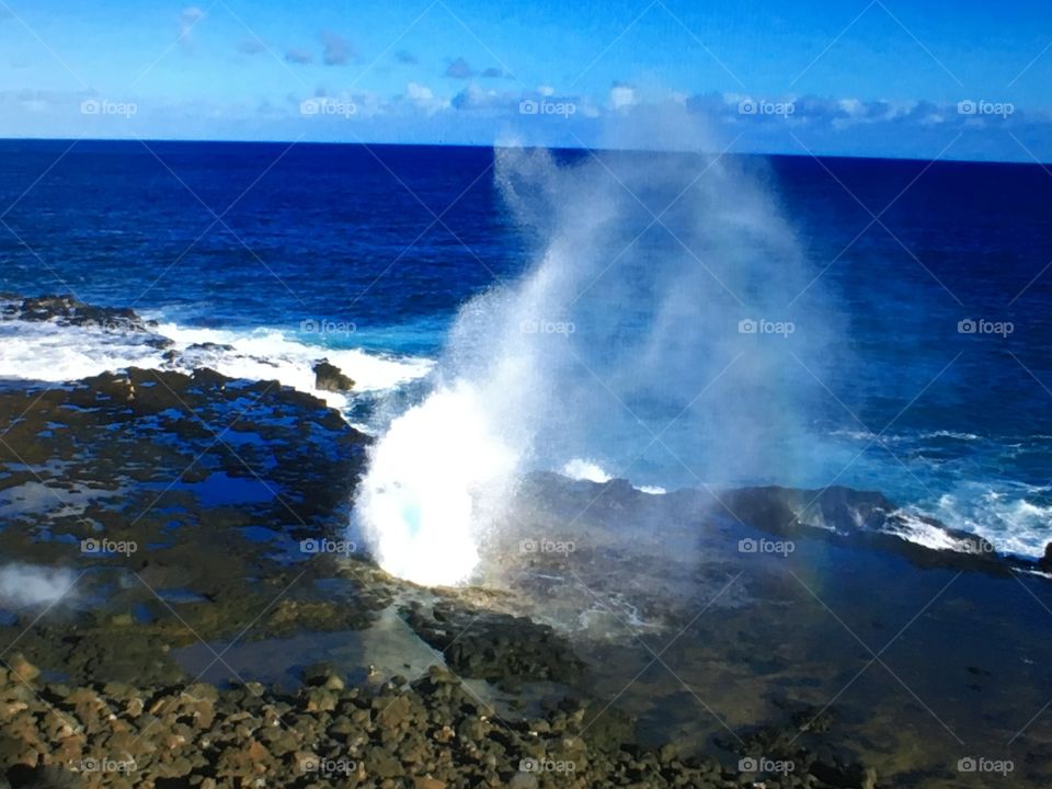 A blowhole along the beach on the island of Kauai, Hawaii.