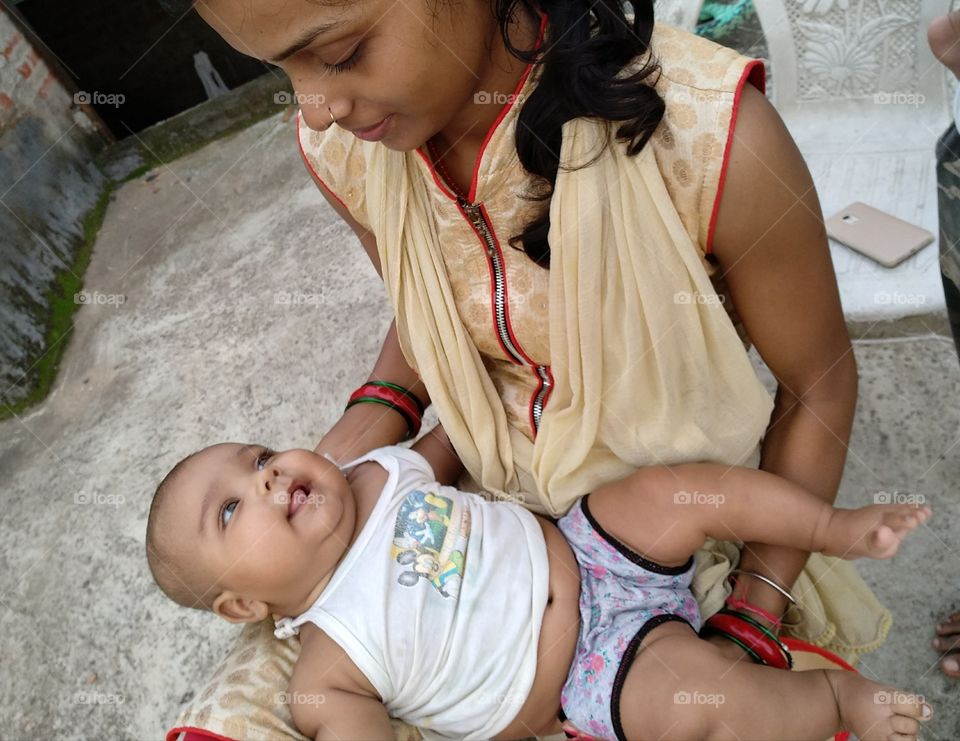 cute baby smile with mom