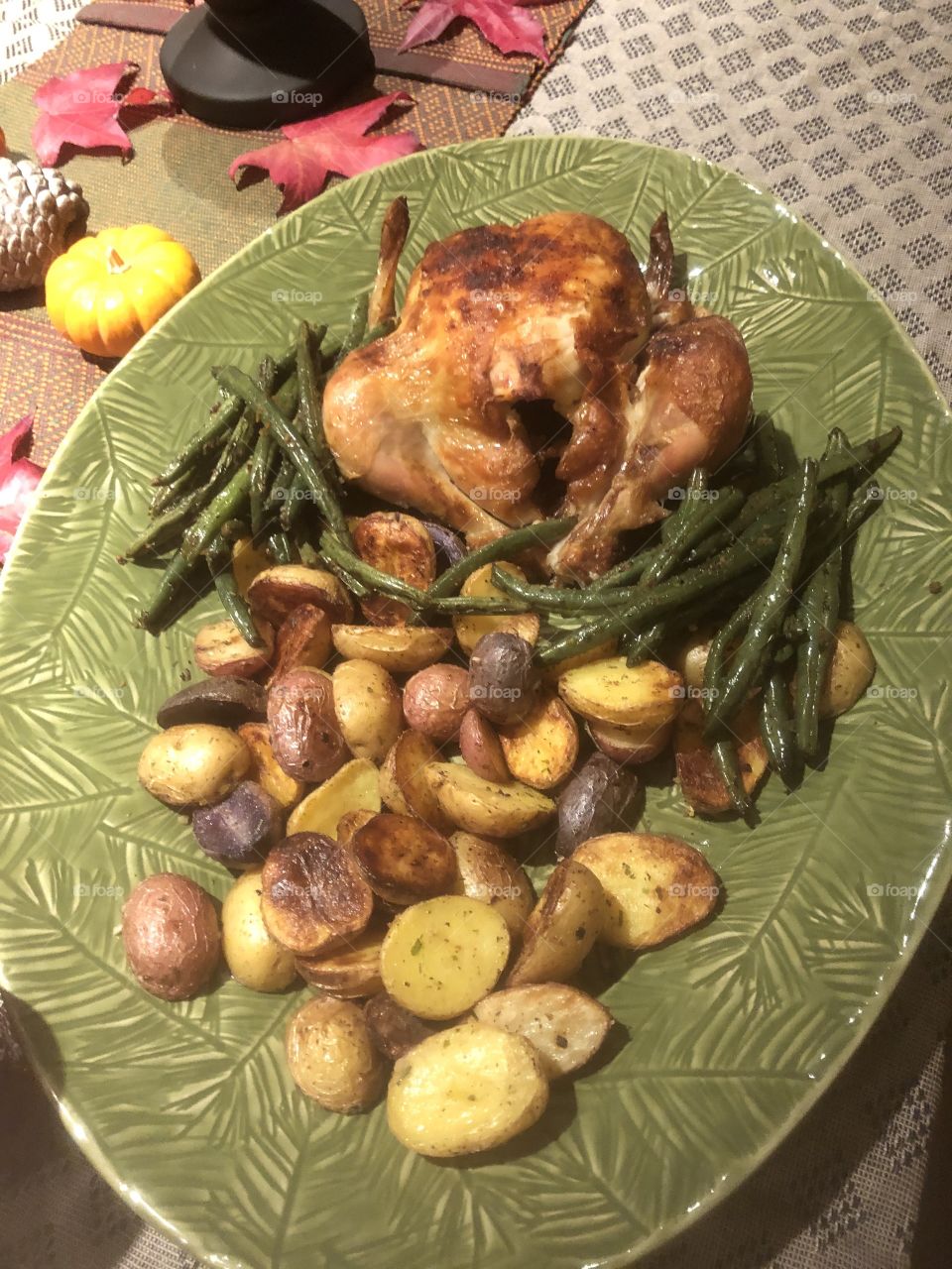 Thanksgiving dinner with friends and family. Baked potatoes, lightly spiced green beans and stuffed chicken, instead of turkey, for the small family. 
