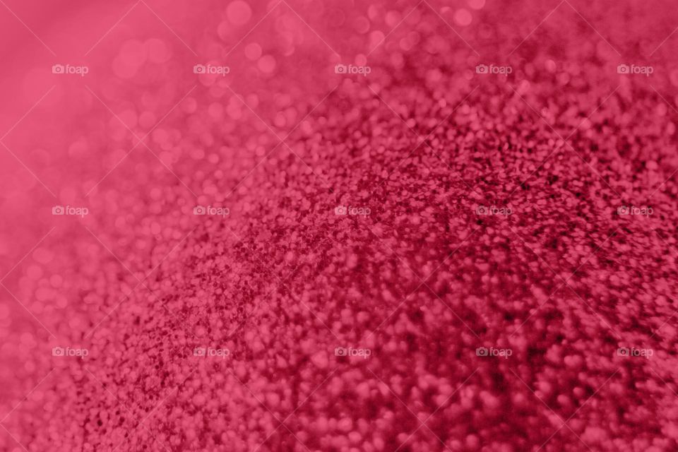 Christmas background in trendy color of 2023 year viva magenta 