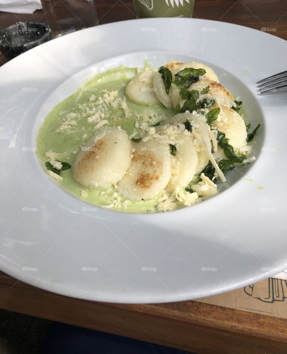 Tapioca ravioli and herbs sauce in Brazilian style 