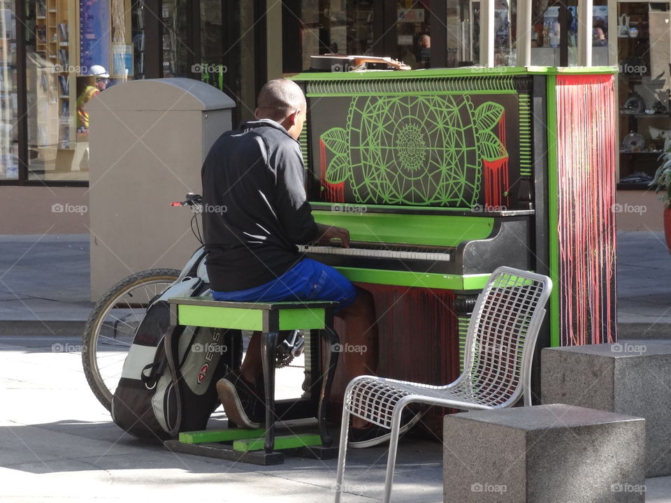 Street piano player in denver