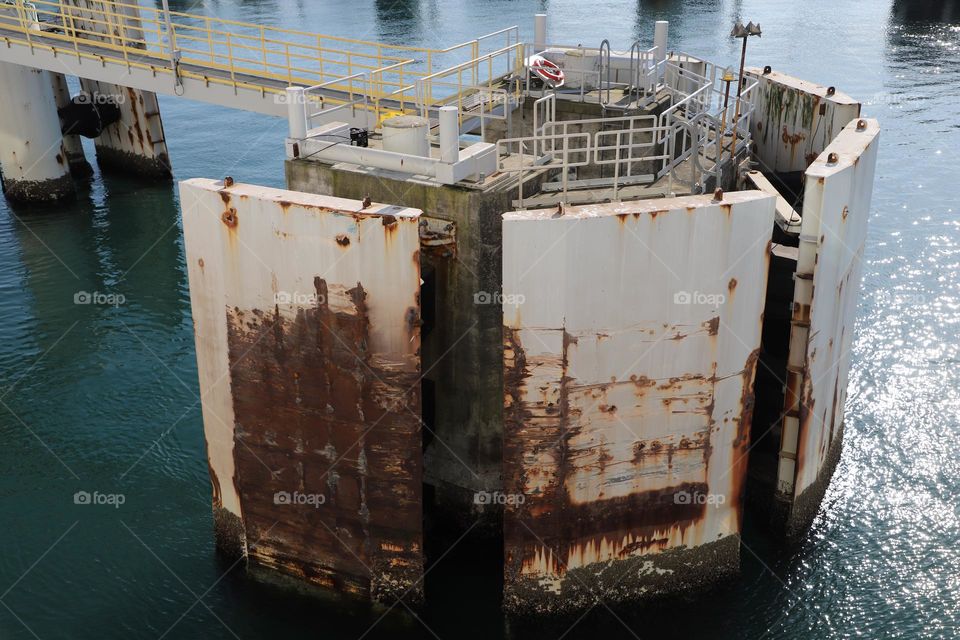 Rusty metallic structures on a dock 