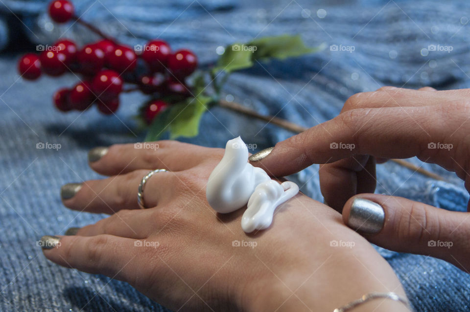 Girl uses a cream for hands