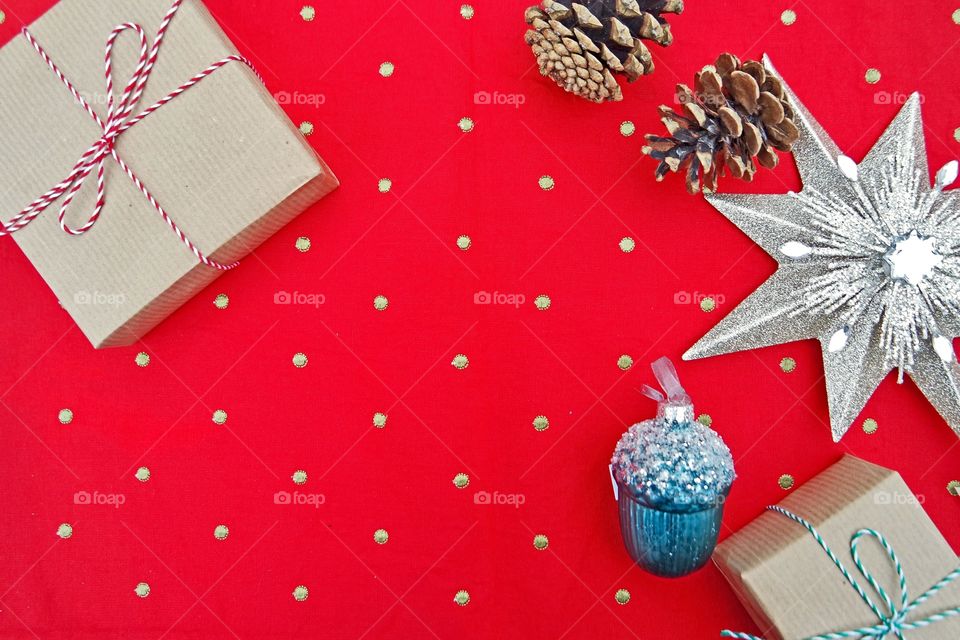 Red polka dots table cloth with Christmas presents and deco.