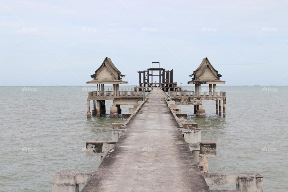 the Pier of an abandoned Buddhist Thai Temple by the Gulf of Thailand Southeast Asia