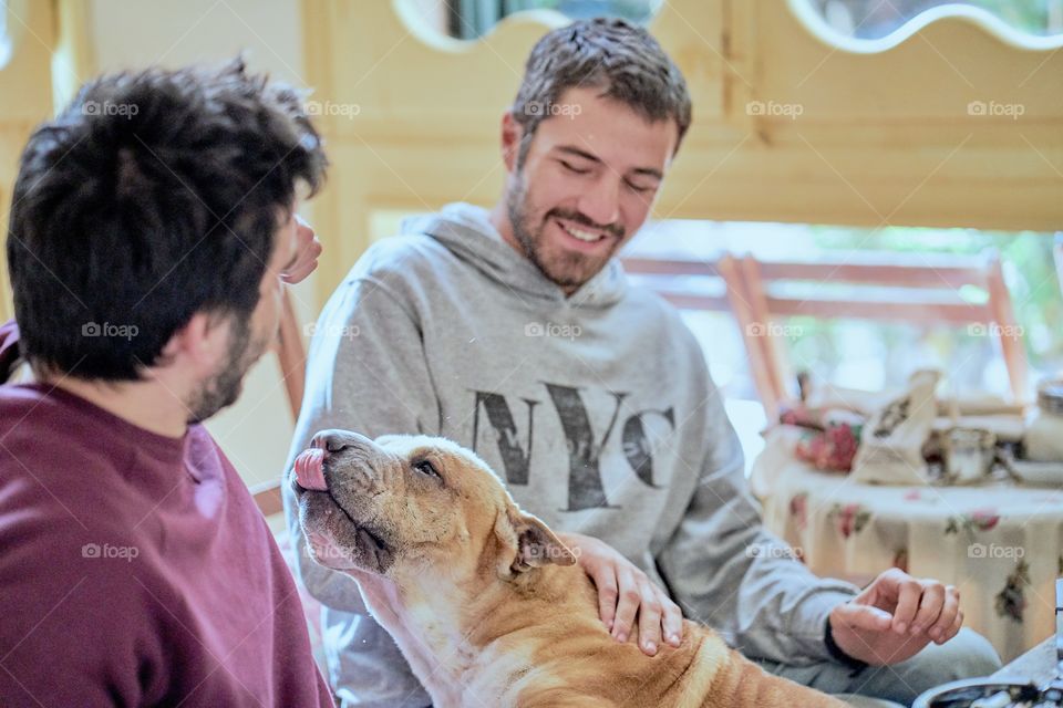 Two man with their dog