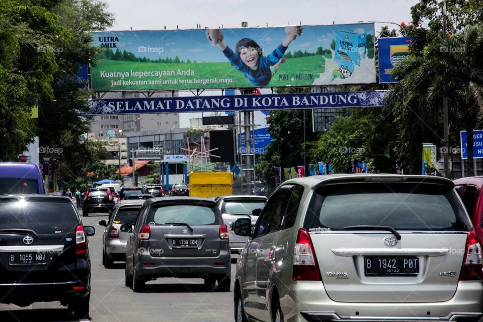 View of cars queuing on the toll road entering the city of Bandung causing traffic jams, Bandung, Indonesia - November 2022.