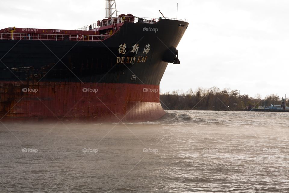 Container ship on foggy Mississippi River 