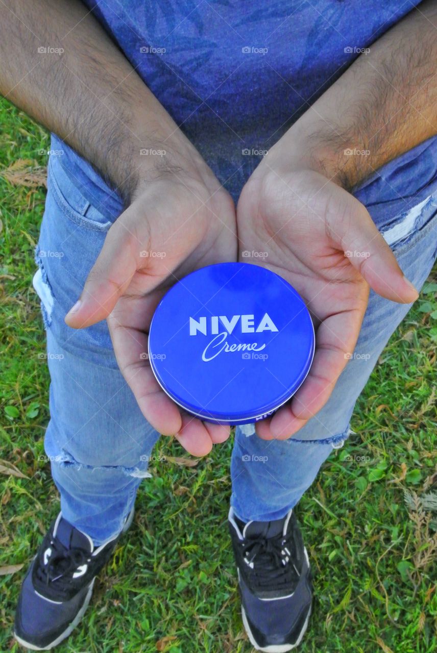 holding nivea cream