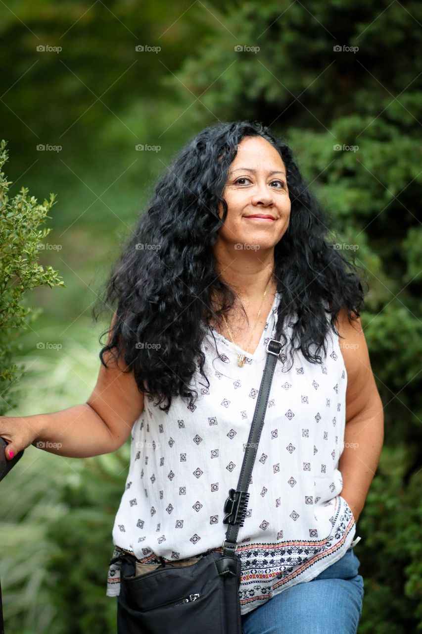 Middle-aged woman with dark curly hair