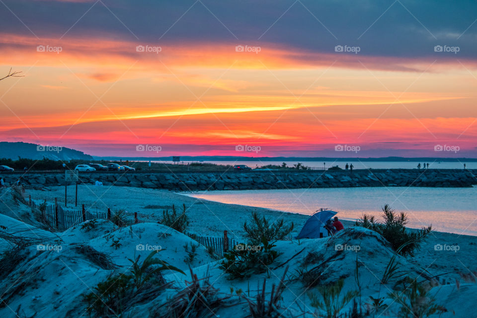 The sun setting over the bay in Hampton Bays, Long Island, NY.  