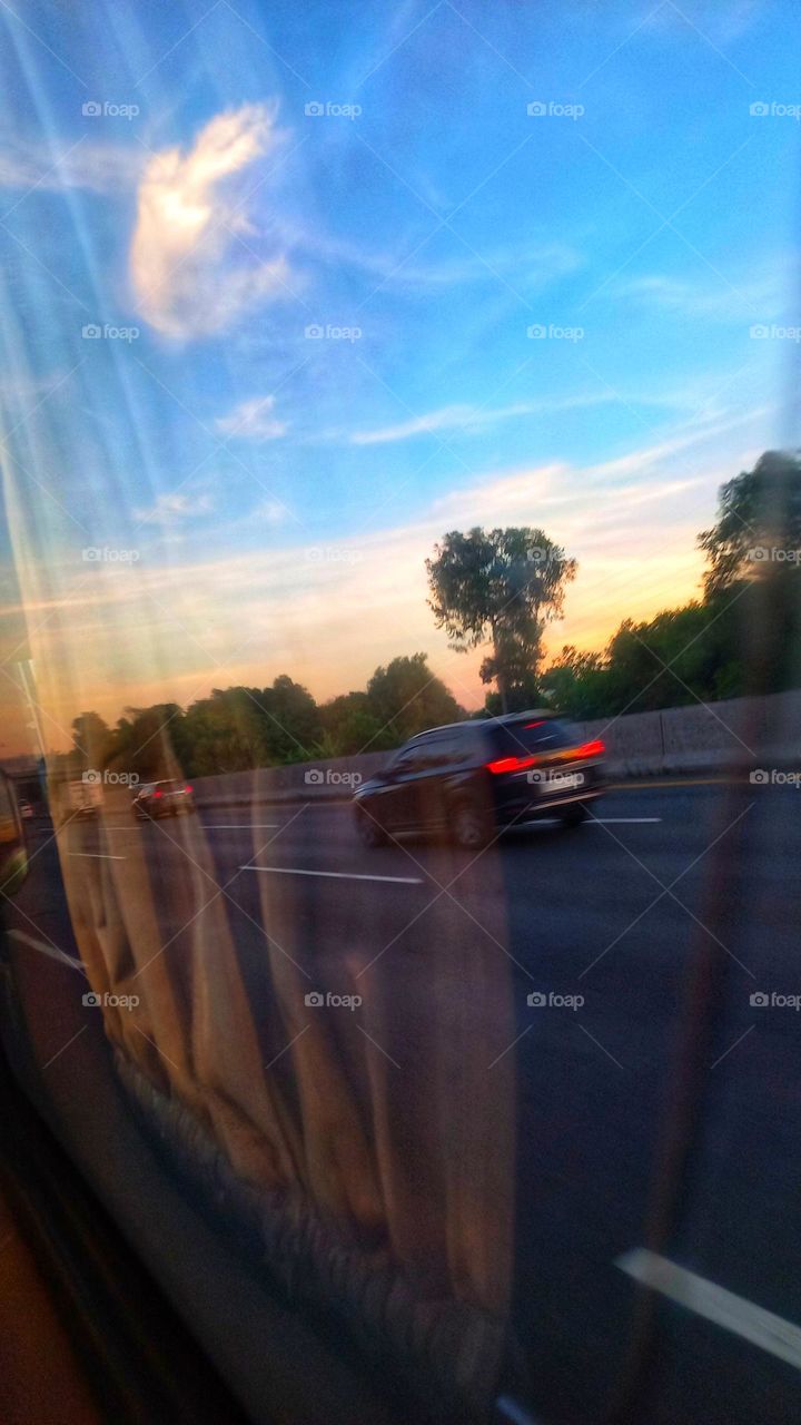 Morning behind the car mirror