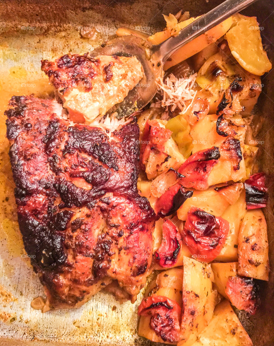 Homemade Roast Pork Meat With Potatoes And Red Pepper
