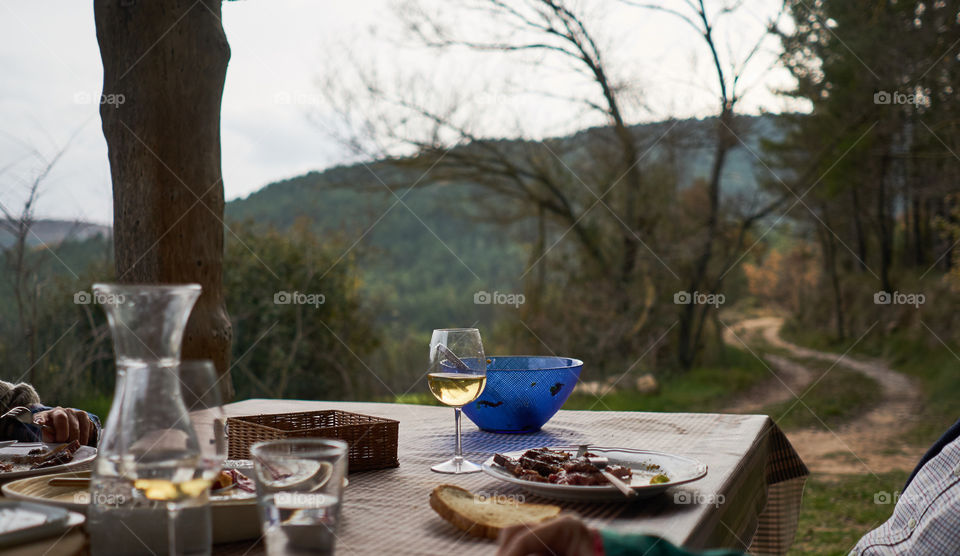 Wineglass and food on table