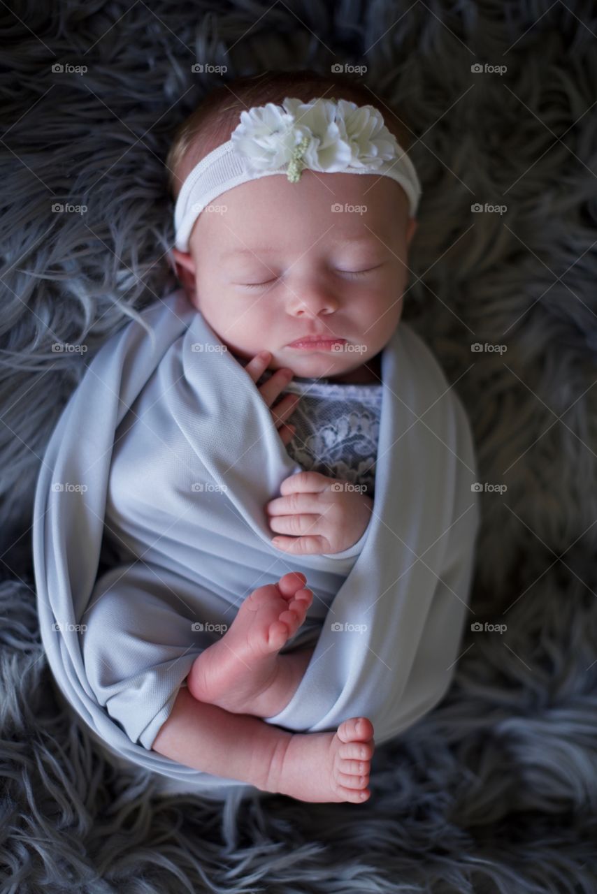 Newborn wrapped in a blanket professional portrait 