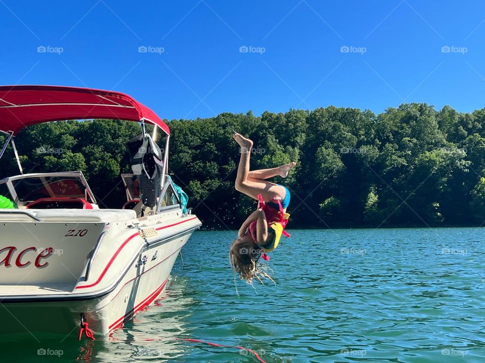 Summer fun doing tricks off the boat