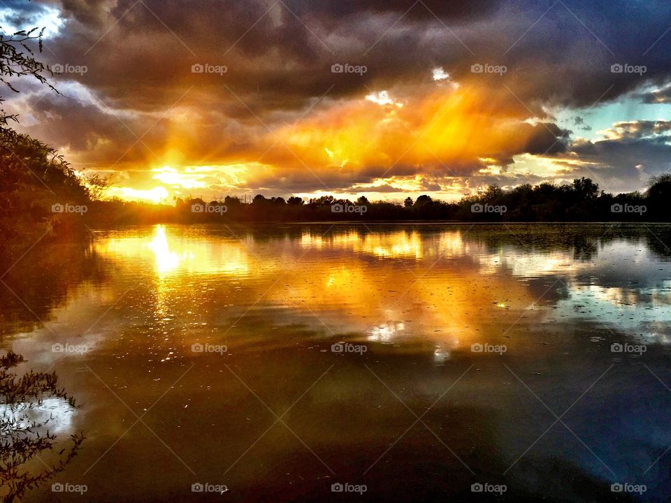 Dramatic sky reflected on lake