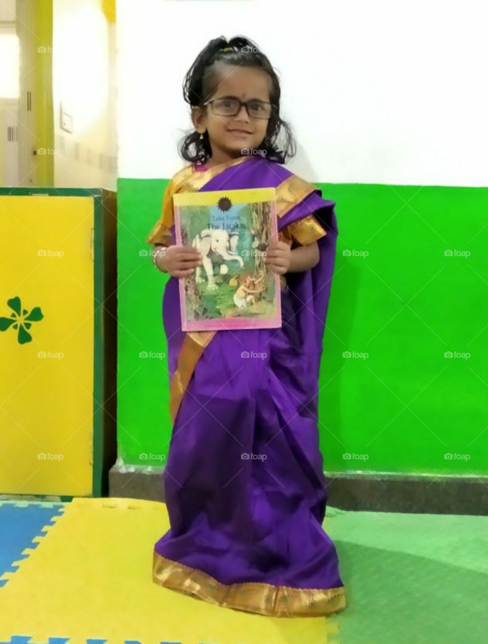 A little girl posing as a Teacher