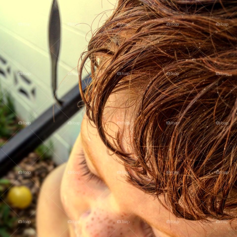 Close-up of boy's brunette hair