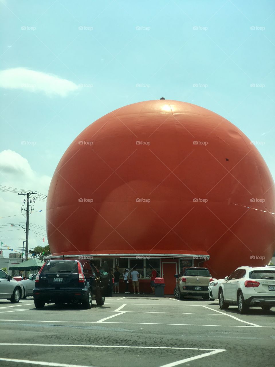 Building in the shape of a large orange: Orange Julius take out drive in location in the shape of an orange in a Montreal Quebec Canada