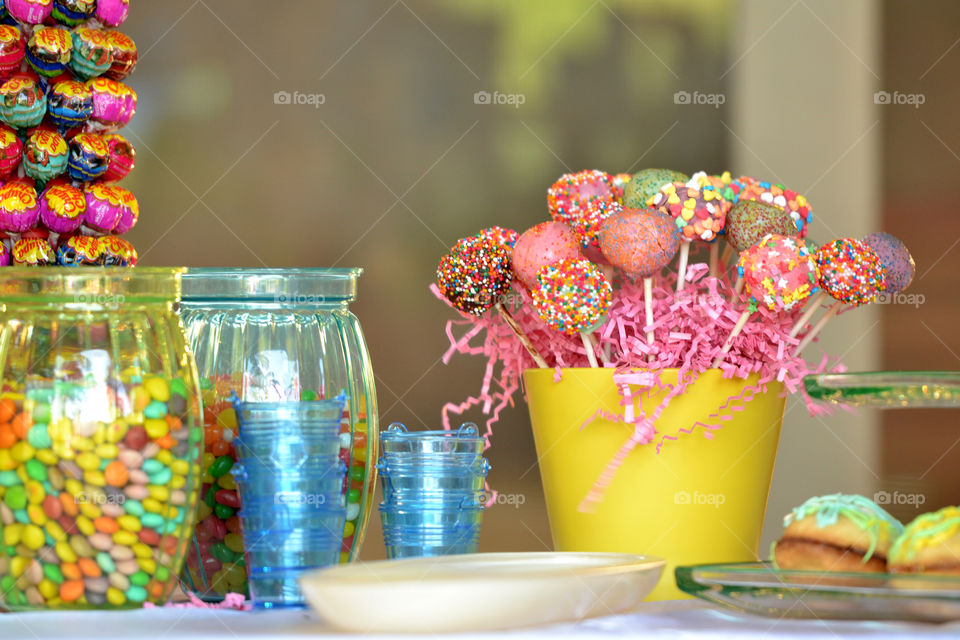 colorful candy table with alot of sweets